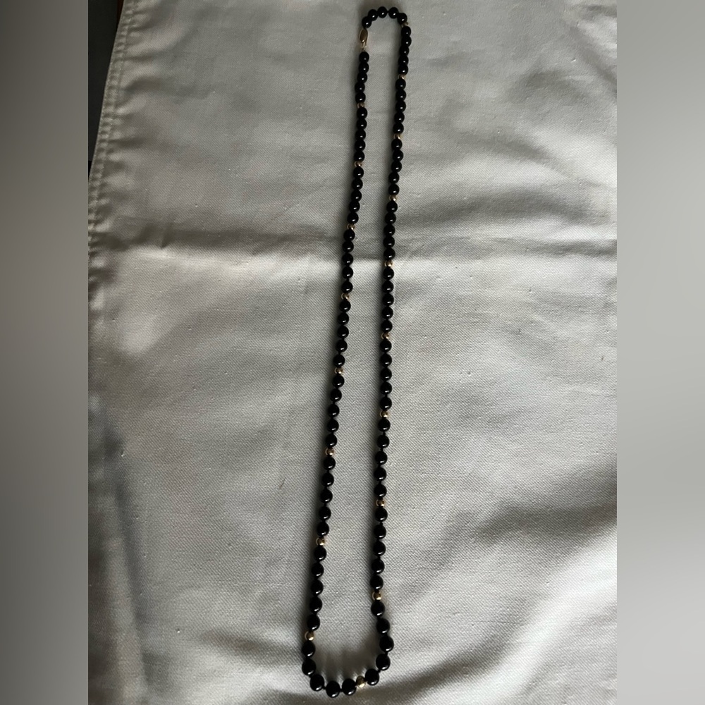 32 inch black onyx necklace 6-6.5 mm with 18 small 14kt gold balls and clasp
